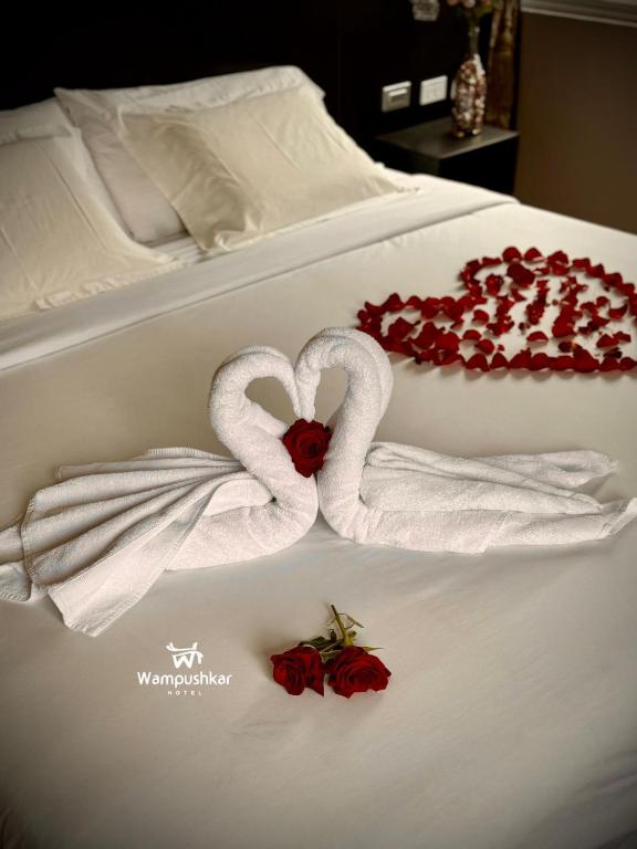 Postel nebo postele na pokoji v ubytování Hotel Wampushkar