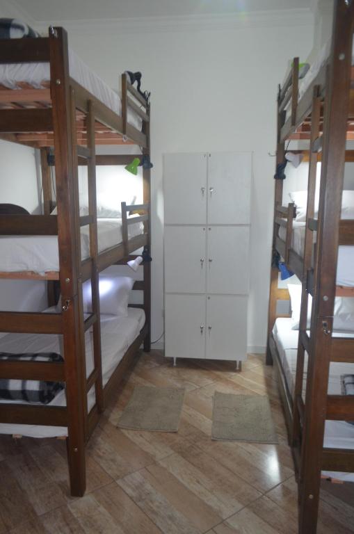 Postel nebo postele na pokoji v ubytování HostelariaSP Boutique
