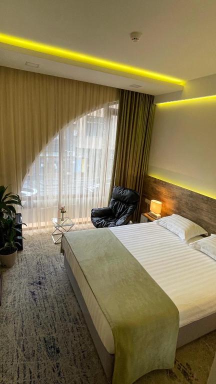 Postel nebo postele na pokoji v ubytování RG Boutique Hotel