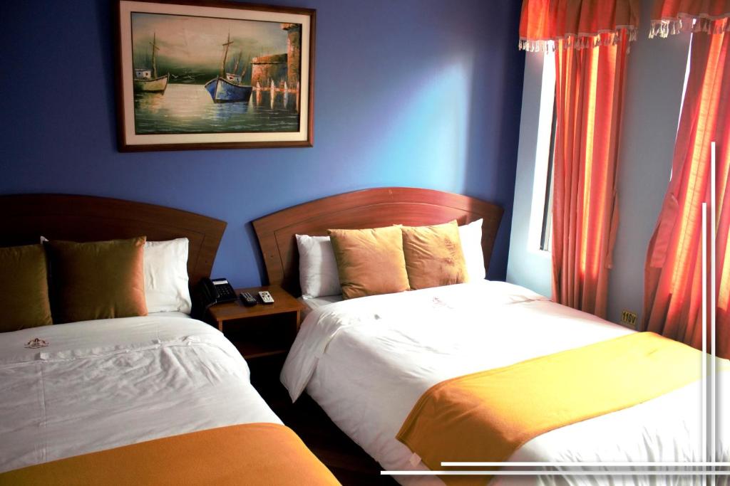 Postel nebo postele na pokoji v ubytování HOTEL MADURAI