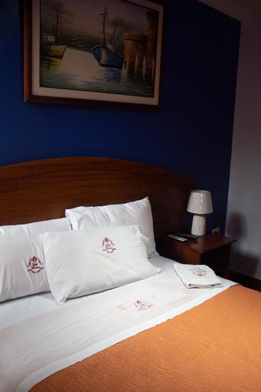 Postel nebo postele na pokoji v ubytování HOTEL MADURAI
