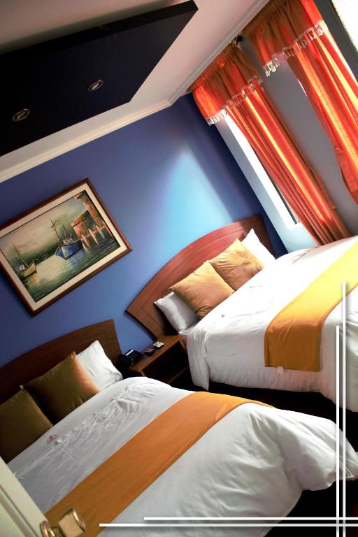 Postel nebo postele na pokoji v ubytování HOTEL MADURAI
