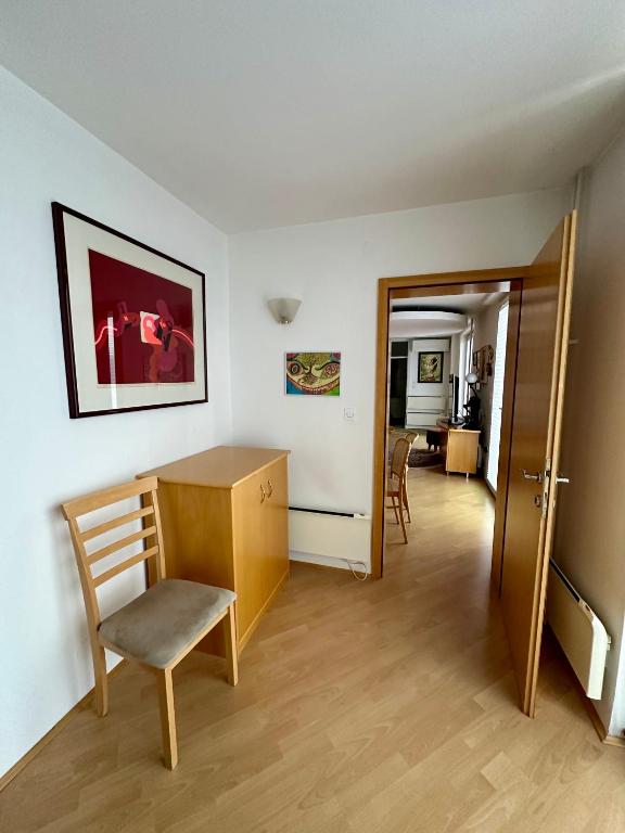 a room with a desk and a chair in a room at MB apartment Bled in Bled