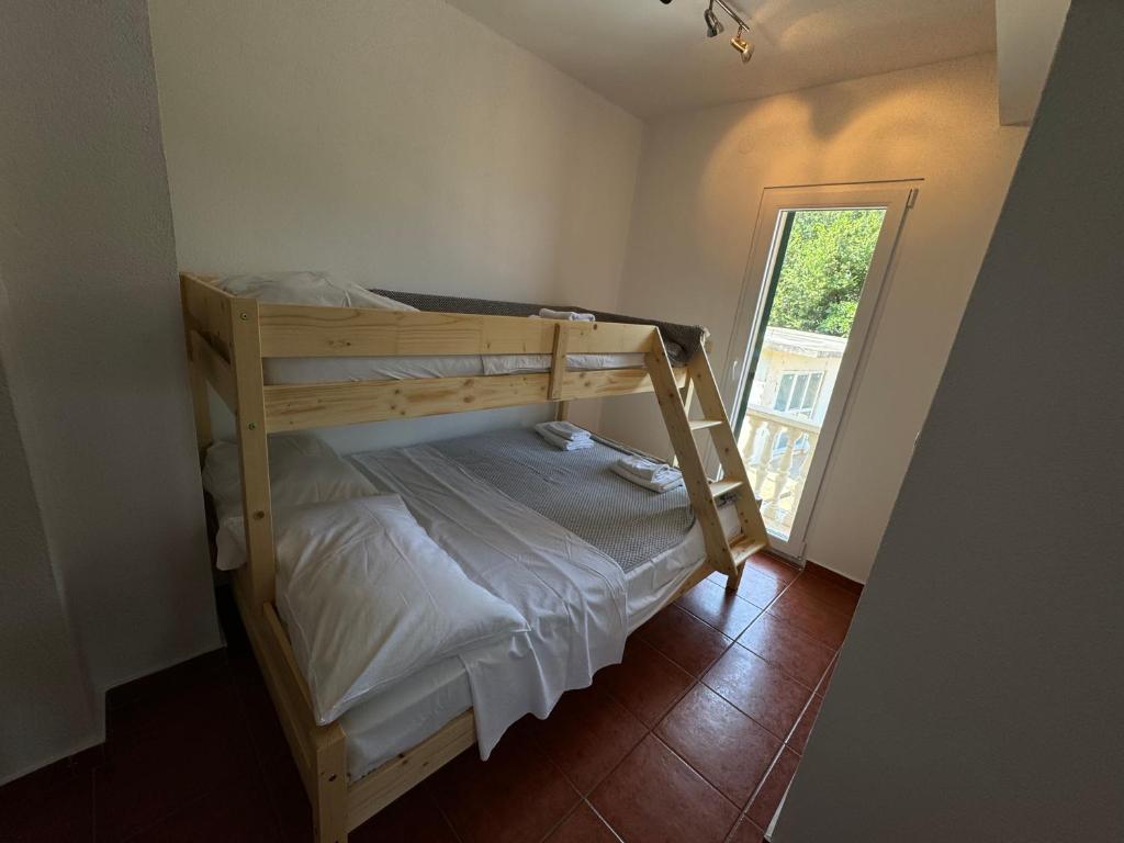 Postel nebo postele na pokoji v ubytování Apartments Prosika