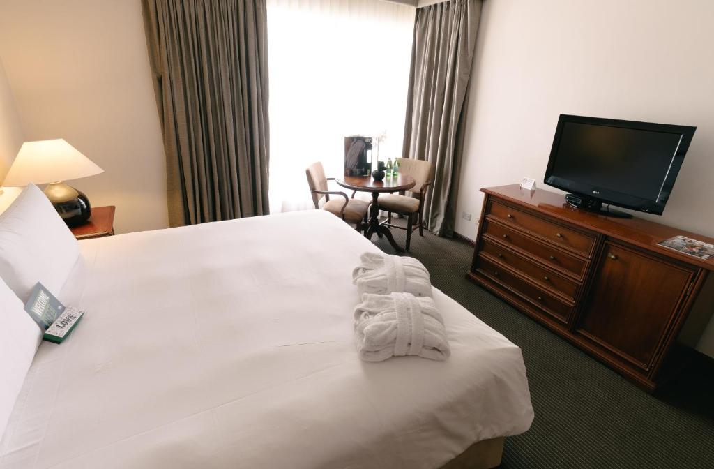 Letto o letti in una camera di BTH Hotel Lima Golf