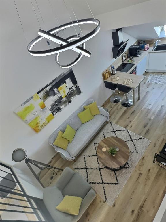 Posedenie v ubytovaní Loft ravissant avec parking gratuit
