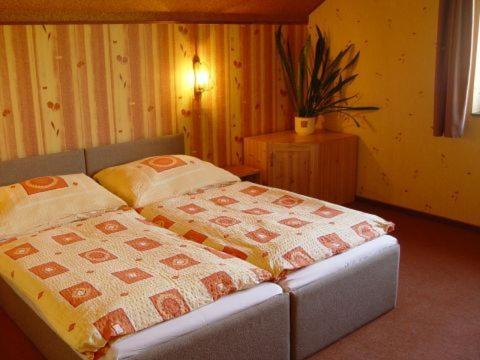 Postel nebo postele na pokoji v ubytování Pension Nostalgie