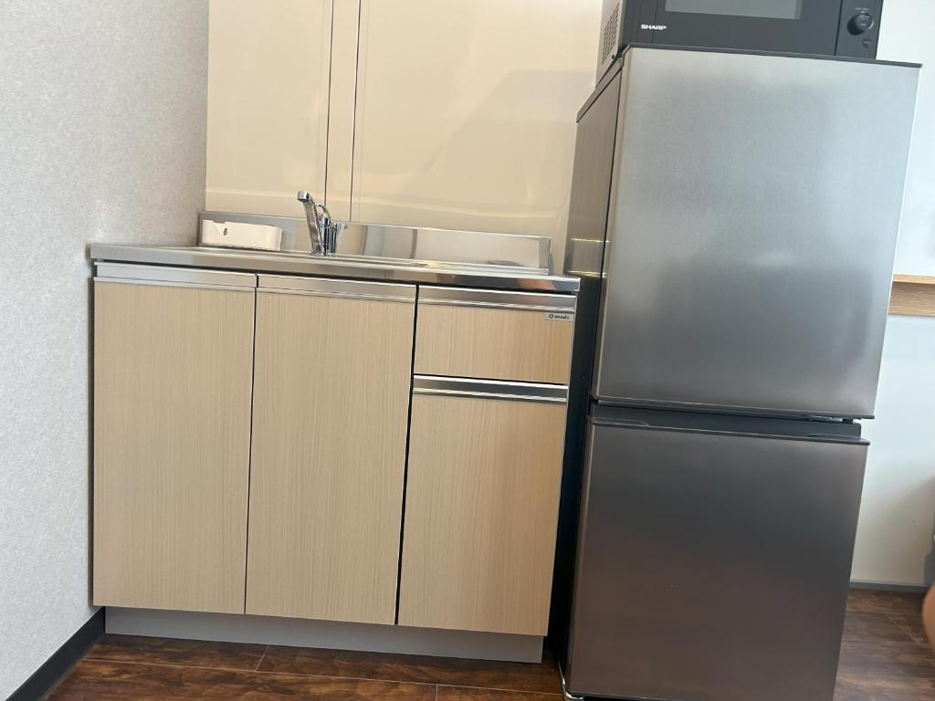 Kuchyň nebo kuchyňský kout v ubytování Daigo Kujigawa Base Hotel