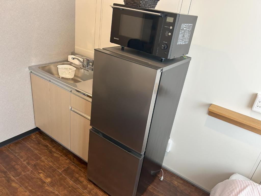 Kuchyň nebo kuchyňský kout v ubytování Daigo Kujigawa Base Hotel