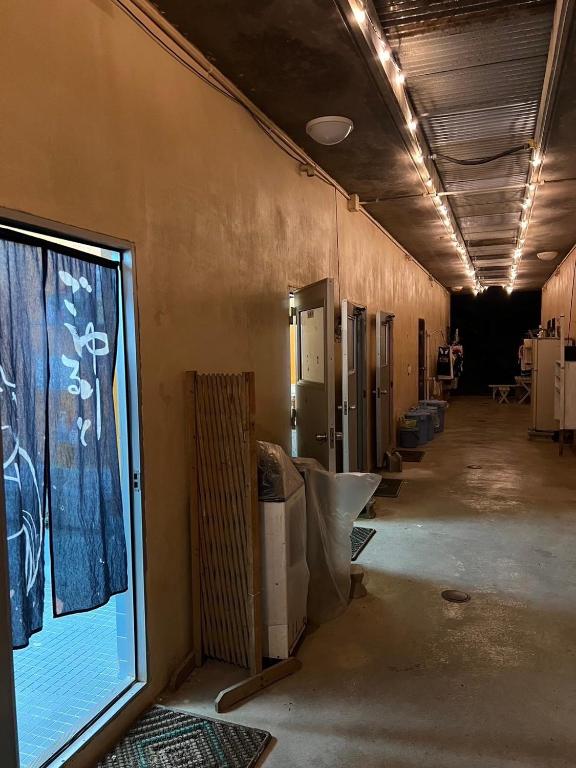 a hallway of a building with a large window at やどバンブー in Hateruma