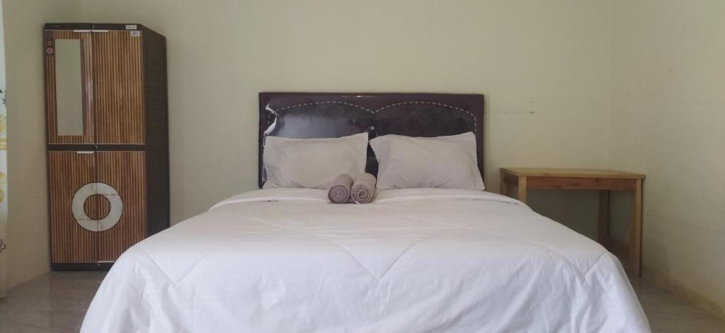 Postel nebo postele na pokoji v ubytování Selow Homestay