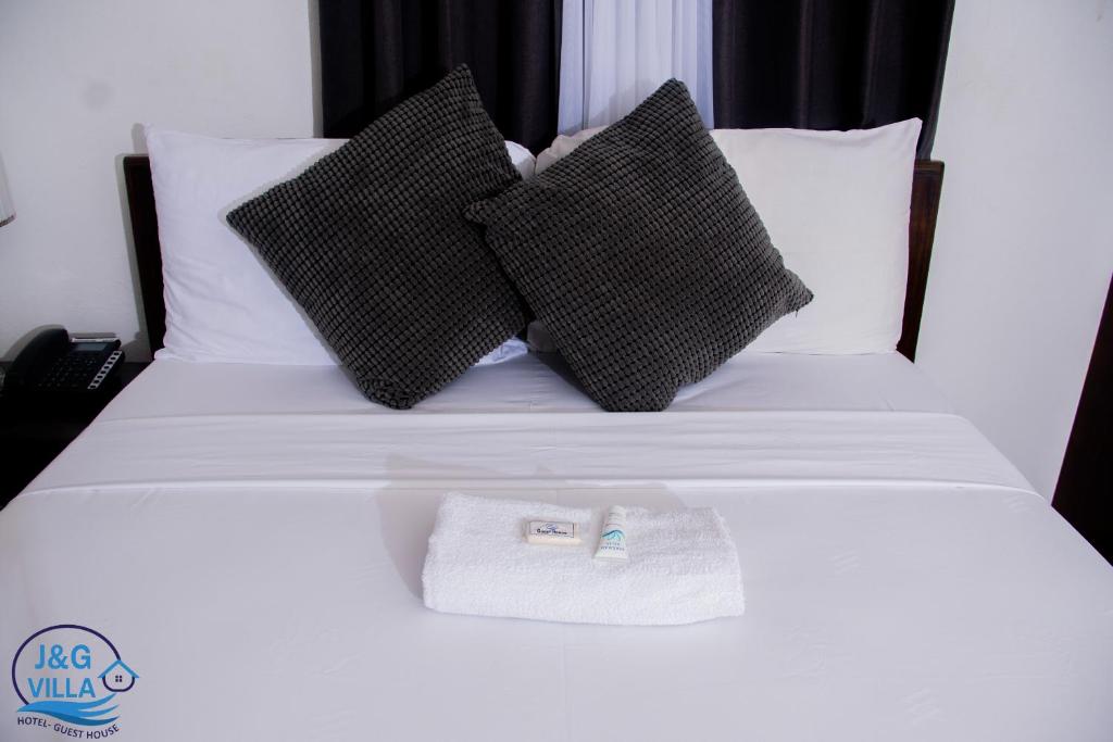 Postel nebo postele na pokoji v ubytování J&G Villa Hotel