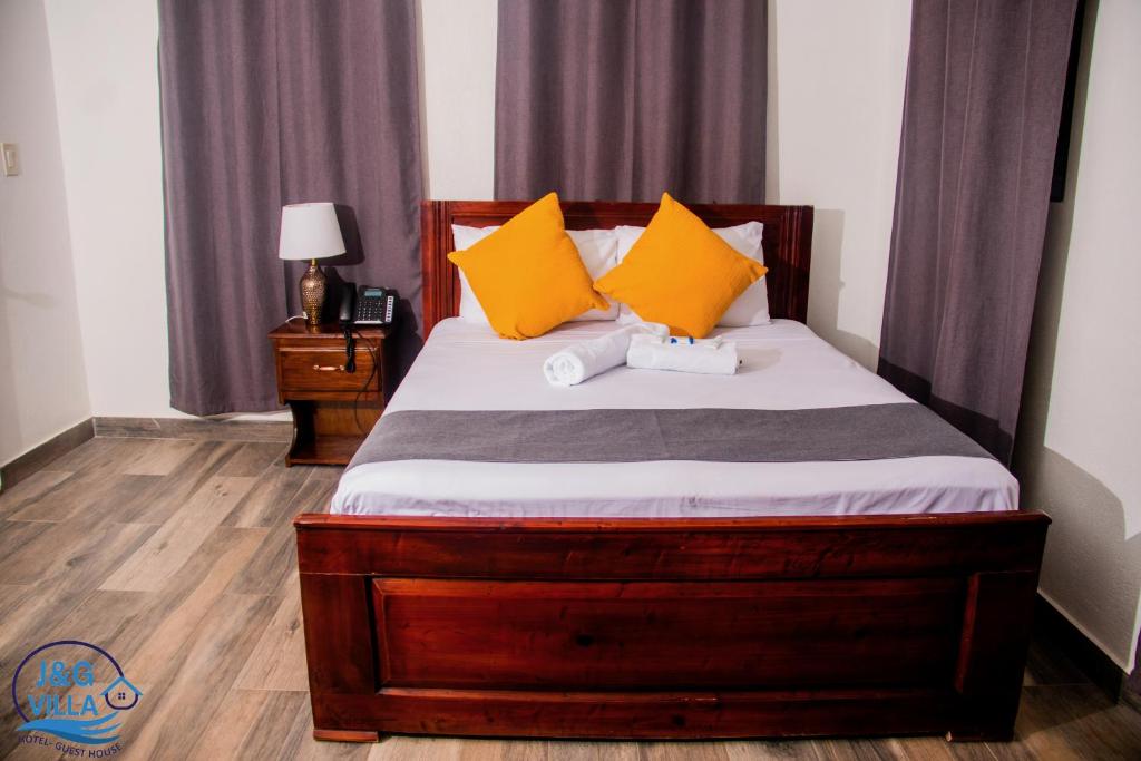 Postel nebo postele na pokoji v ubytování J&G Villa Hotel