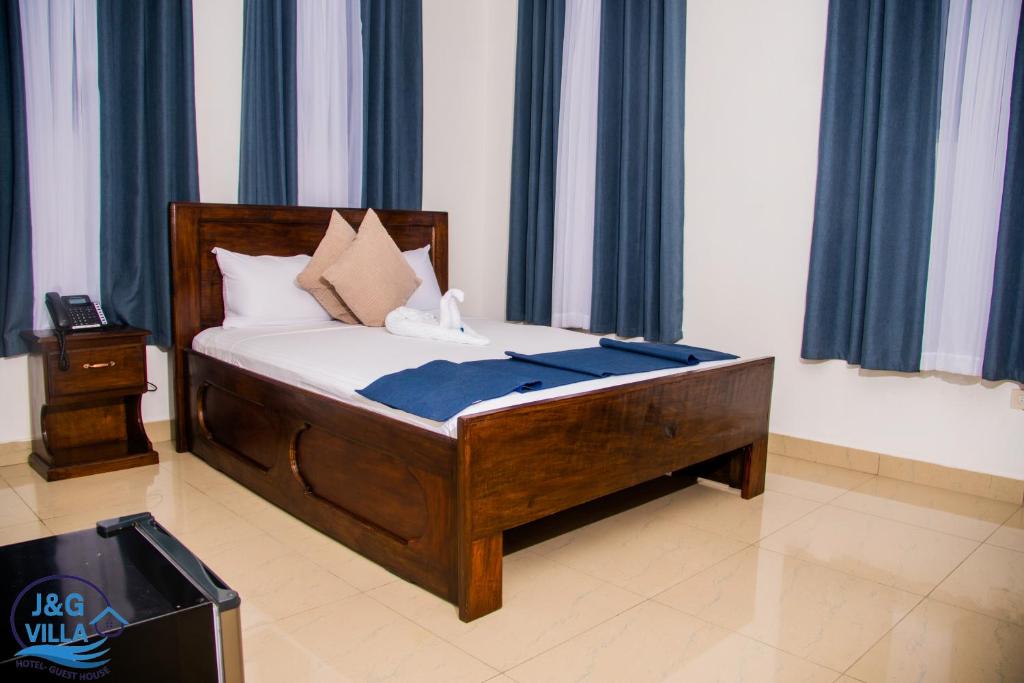 Postel nebo postele na pokoji v ubytování J&G Villa Hotel