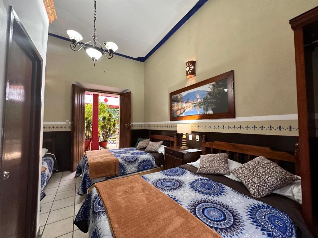 Postel nebo postele na pokoji v ubytování Copa de Oro Hotel Boutique