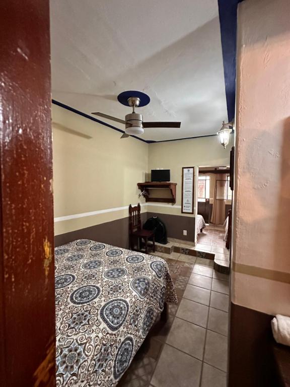 Postel nebo postele na pokoji v ubytování Copa de Oro Hotel Boutique
