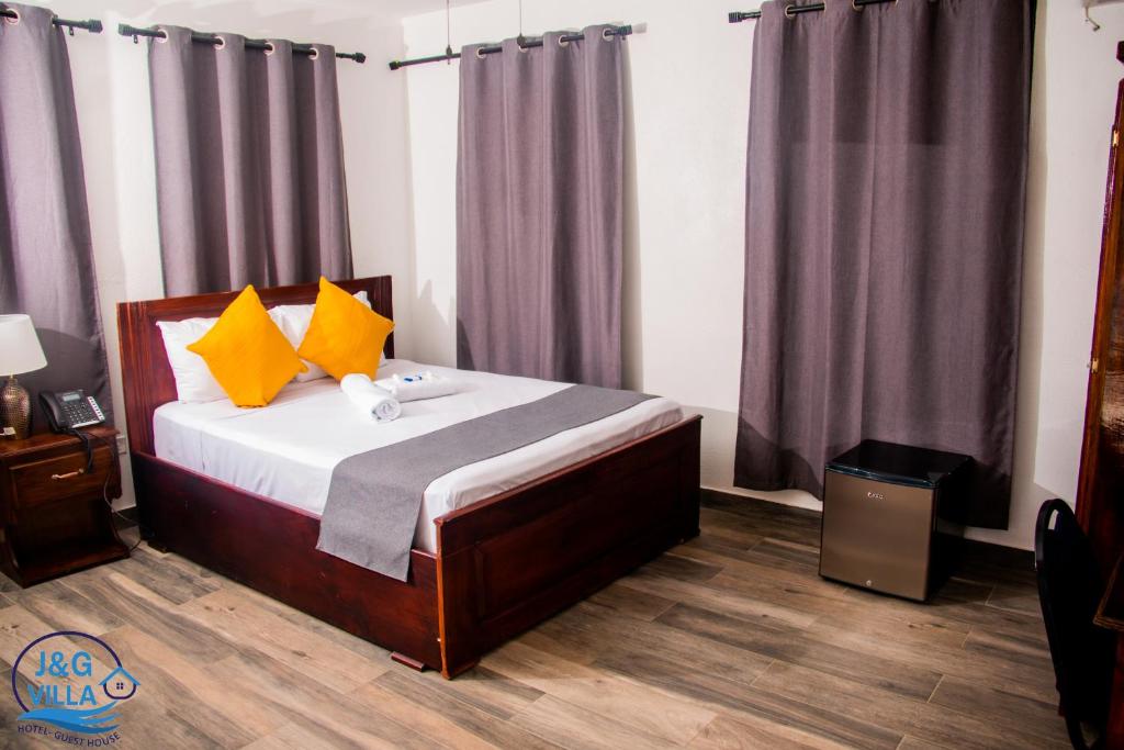 Postel nebo postele na pokoji v ubytování J&G Villa Hotel