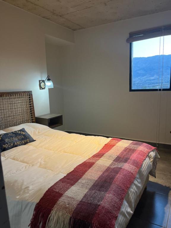 Postel nebo postele na pokoji v ubytování Apapacho casa de Montaña