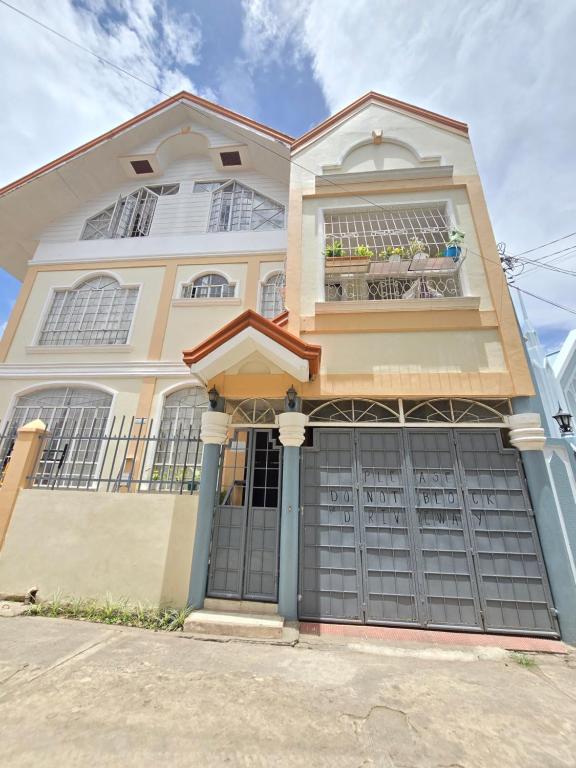 a large house with a large garage at 35 Amistad Guesthouse in Baguio