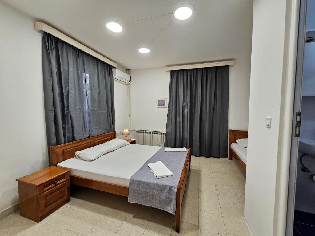 Posteľ alebo postele v izbe v ubytovaní Bravo Plus