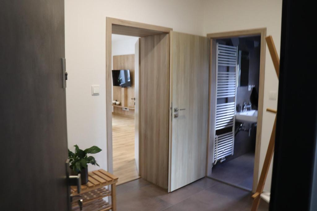 Postel nebo postele na pokoji v ubytování Apartmány B. Němcové