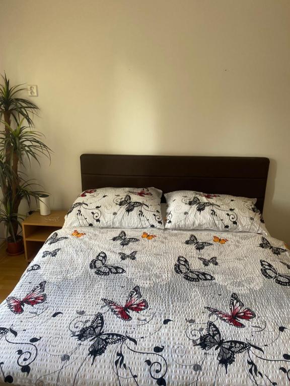 A bed or beds in a room at Penzion Rosnicka Liesek