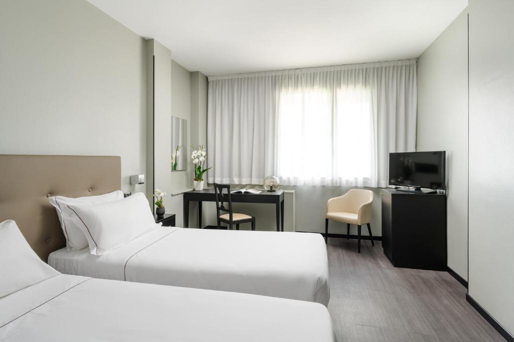 Postel nebo postele na pokoji v ubytování Smart Hotel King, by R Collection Hotels