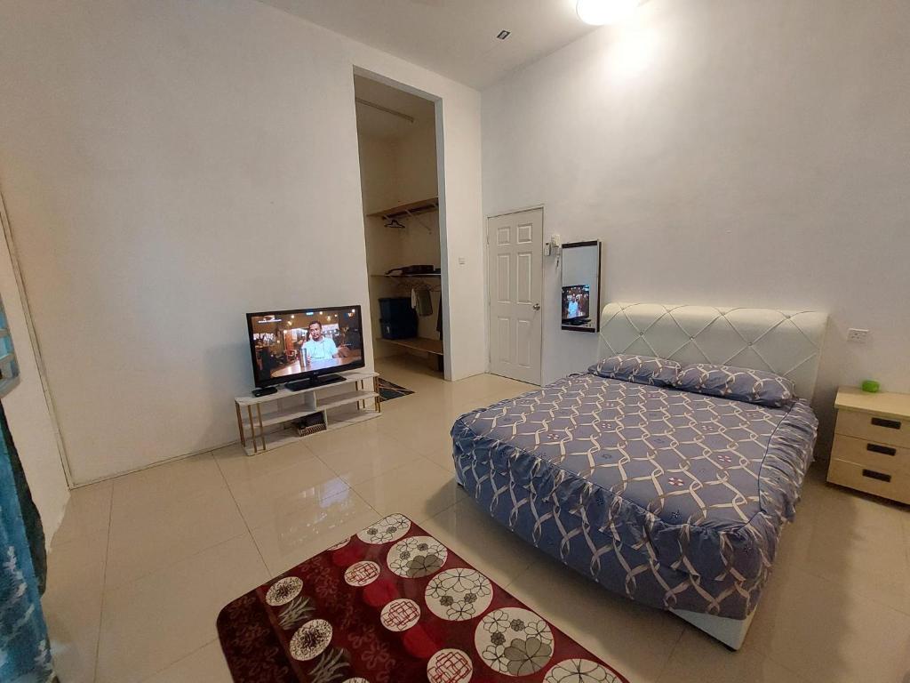 TV a/nebo společenská místnost v ubytování Bin Nor Homestay