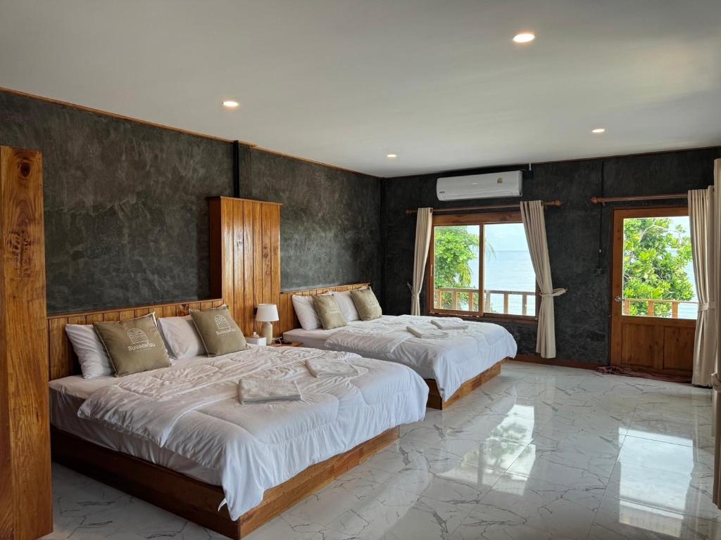 Ένα ή περισσότερα κρεβάτια σε δωμάτιο στο Libong Loft Home