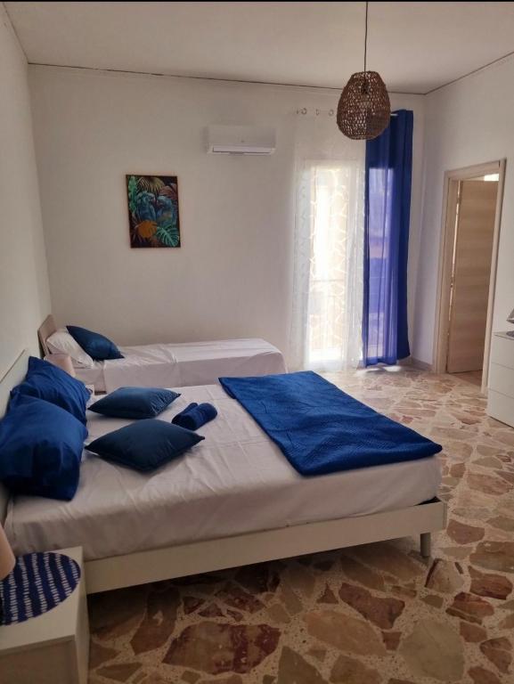 Postel nebo postele na pokoji v ubytování Onda blu