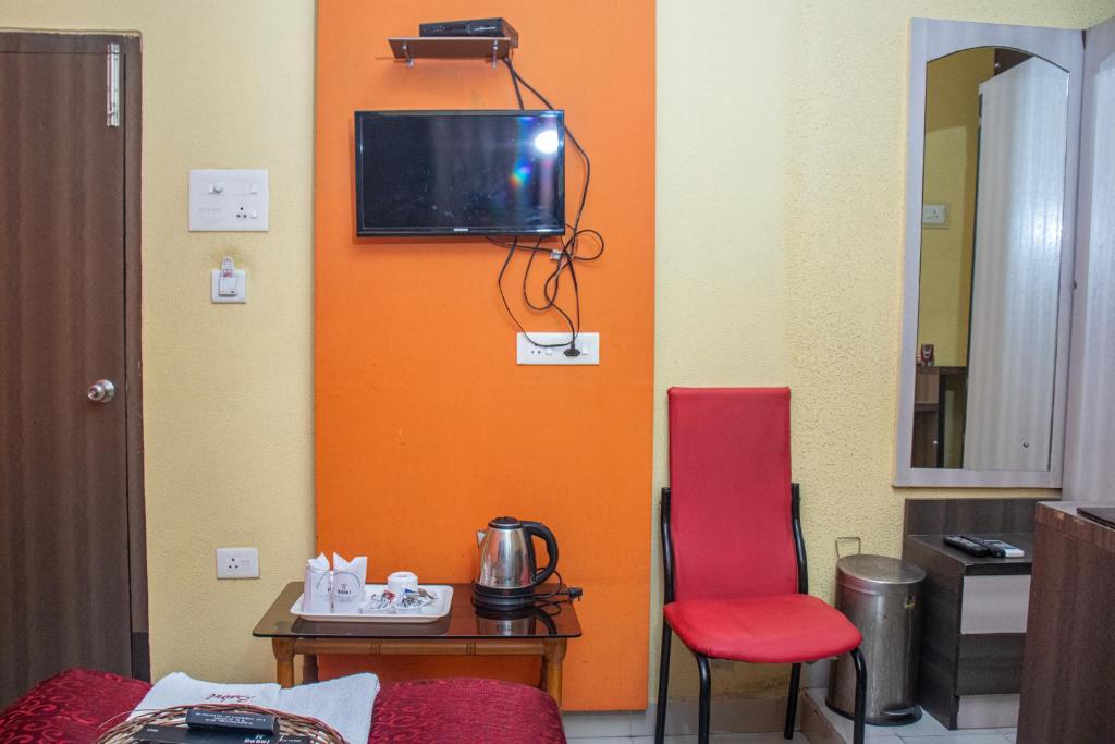 TV a/nebo společenská místnost v ubytování Babul Hotel
