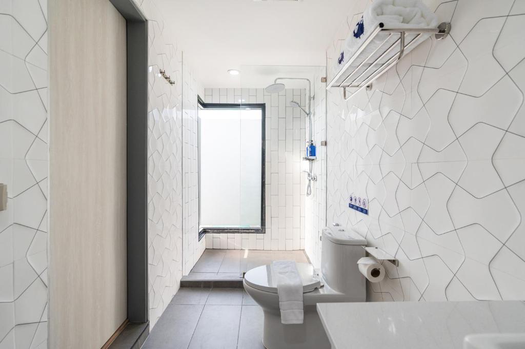 Koupelna v ubytování Kokotel Chiang Rai Airport Suites