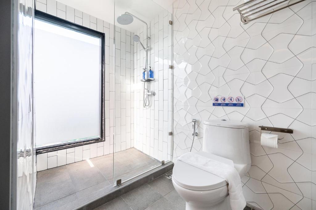 Koupelna v ubytování Kokotel Chiang Rai Airport Suites