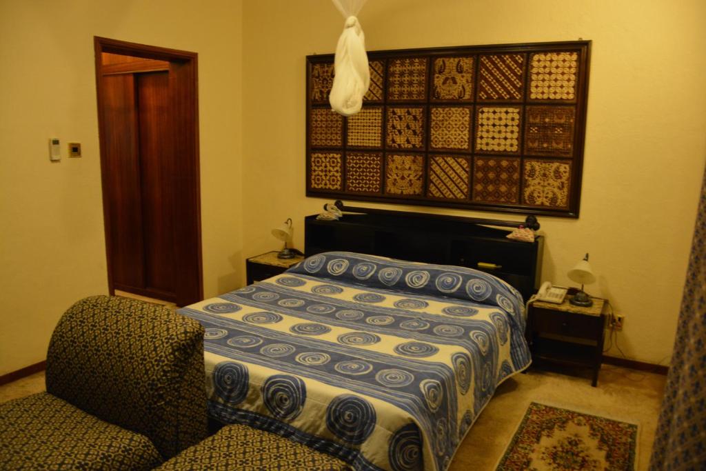 Postel nebo postele na pokoji v ubytování Manuela Residence