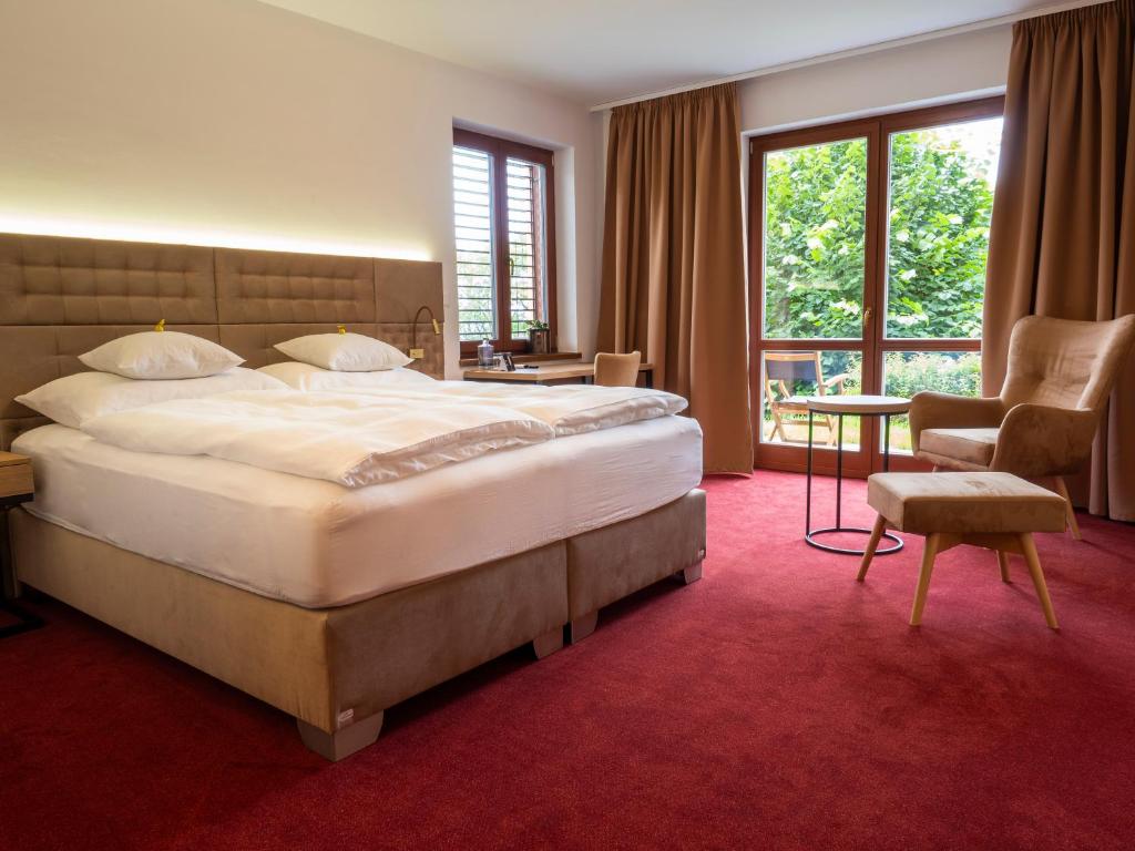 Postel nebo postele na pokoji v ubytování Hotel Cvilín