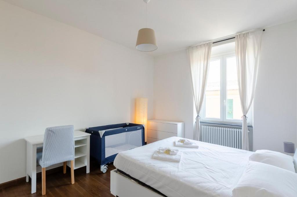 Posteľ alebo postele v izbe v ubytovaní JOIVY Spacious Family Apt for 4, in Carignano, Genoa