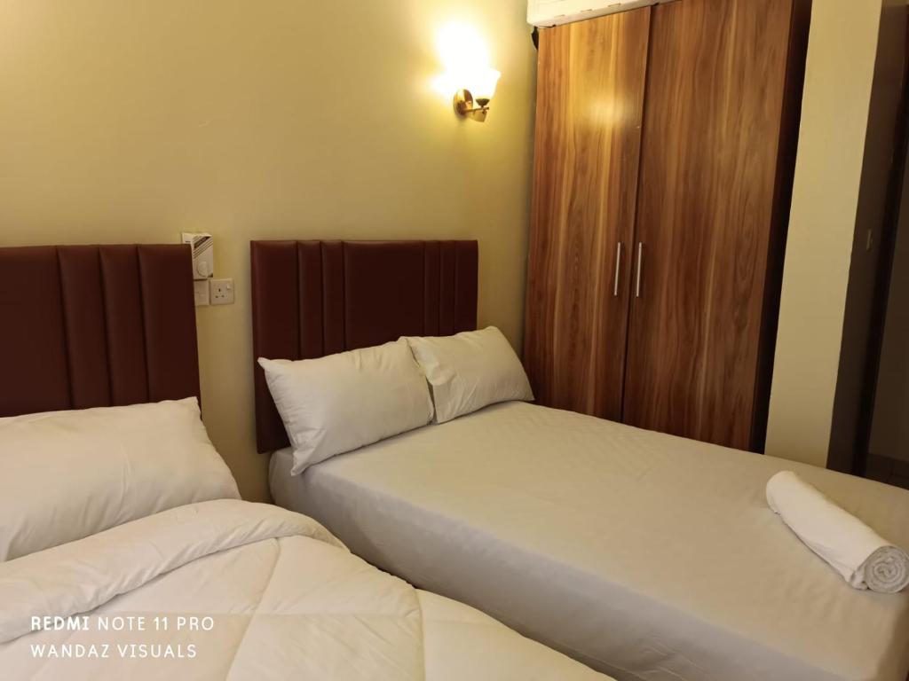 Postel nebo postele na pokoji v ubytování Elegant rooms and apartment with pool in Nyali