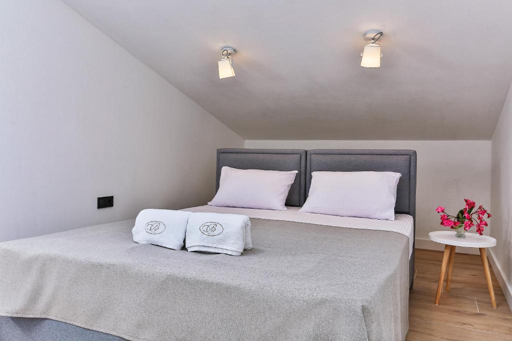 Postel nebo postele na pokoji v ubytování Apartments Magic box II