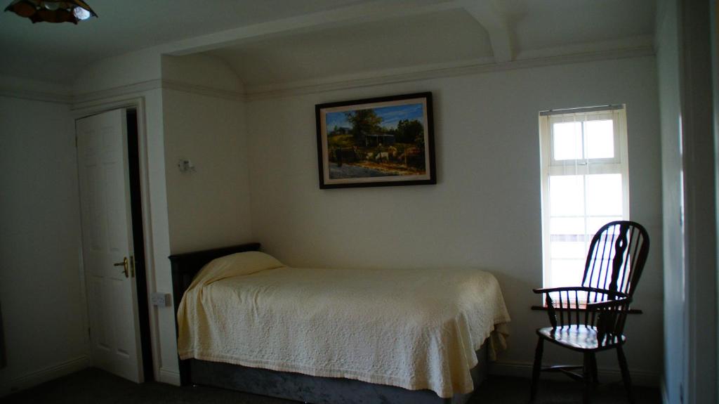 Postel nebo postele na pokoji v ubytování Rockville House B&B