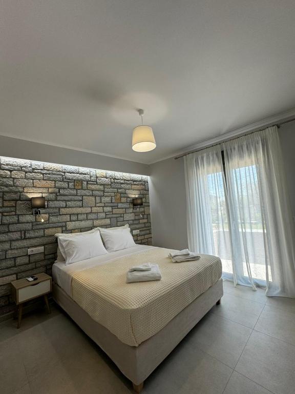 Łóżko lub łóżka w pokoju w obiekcie Iris Villas Complex