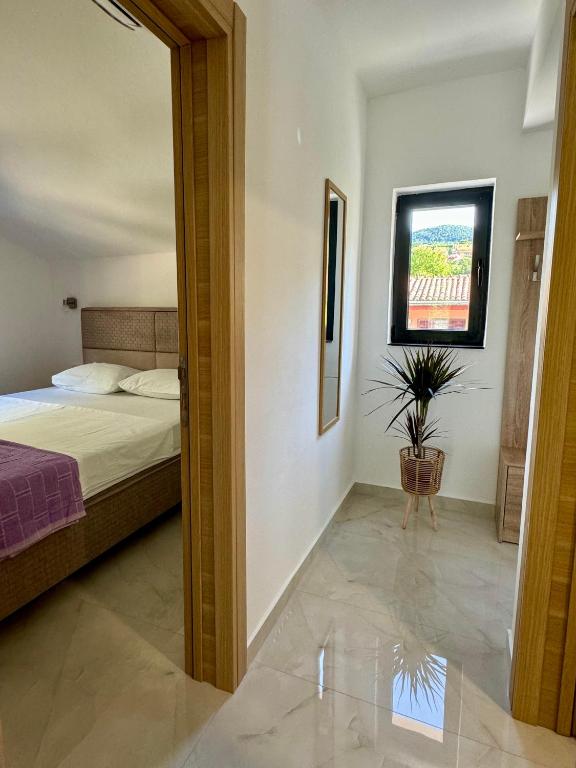 Postel nebo postele na pokoji v ubytování Harmony Garden Apartments