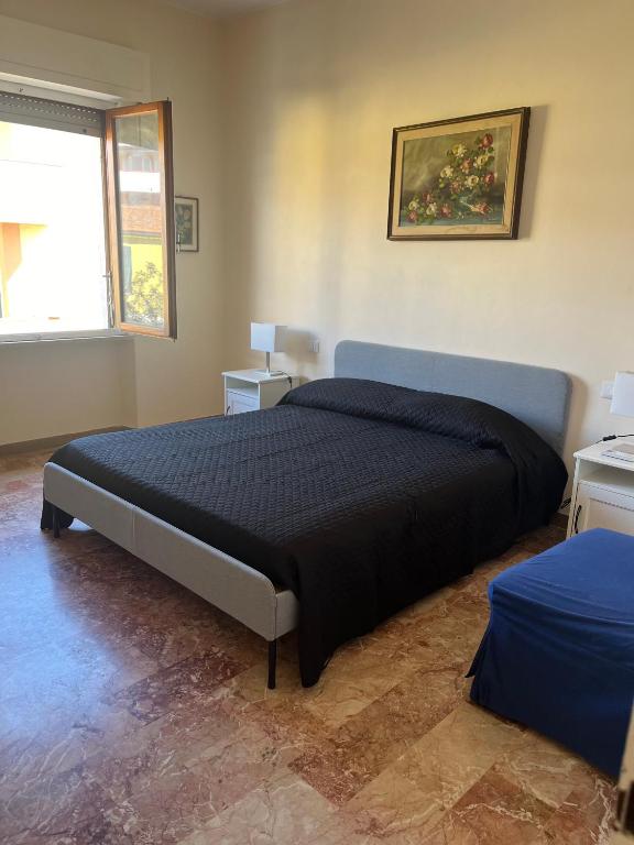 a bedroom with a large bed in a room at Casa Giovenza in Porto Azzurro