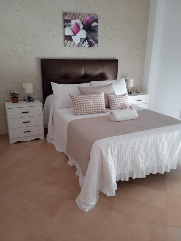 Łóżko lub łóżka w pokoju w obiekcie Casa nueva en Urbanización la Biznaga