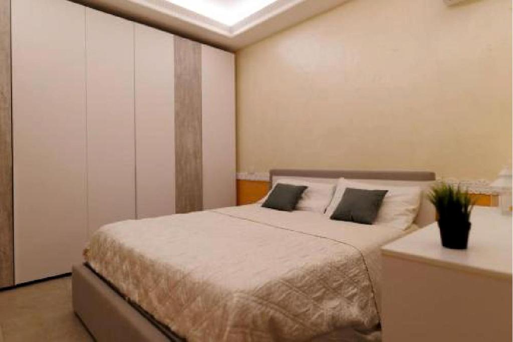 a bedroom with a bed and a skylight at Villa Brachychiton in Ostuni