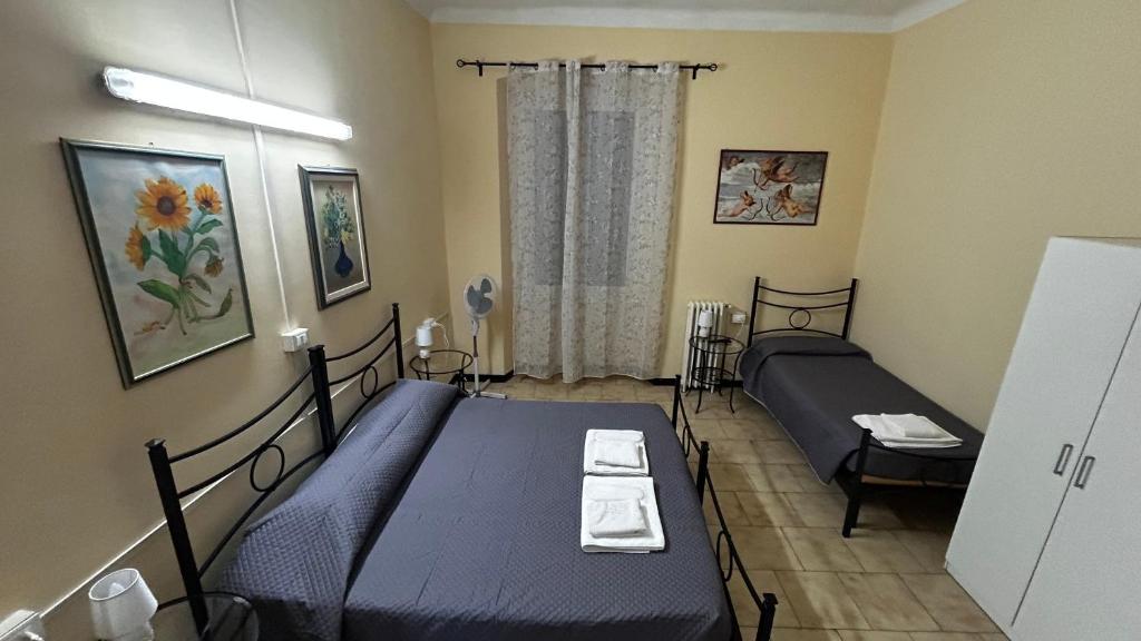 Postel nebo postele na pokoji v ubytování Albergo Fiorita