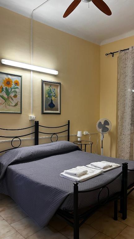 Postel nebo postele na pokoji v ubytování Albergo Fiorita