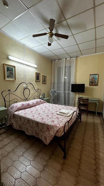 Postel nebo postele na pokoji v ubytování Albergo Fiorita