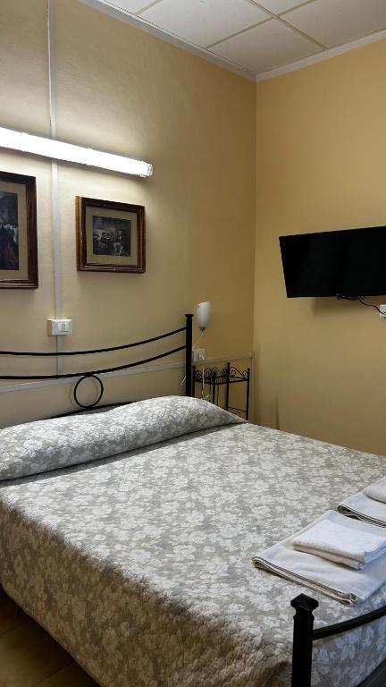 Postel nebo postele na pokoji v ubytování Albergo Fiorita
