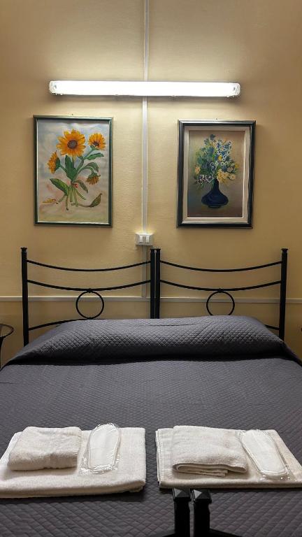 Postel nebo postele na pokoji v ubytování Albergo Fiorita