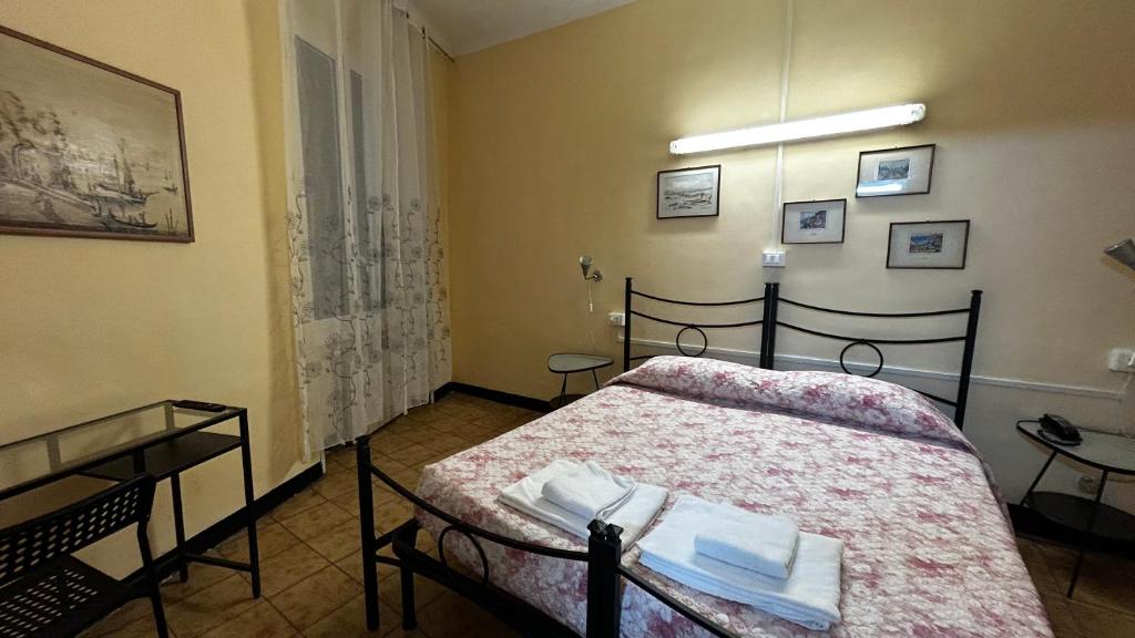 Postel nebo postele na pokoji v ubytování Albergo Fiorita